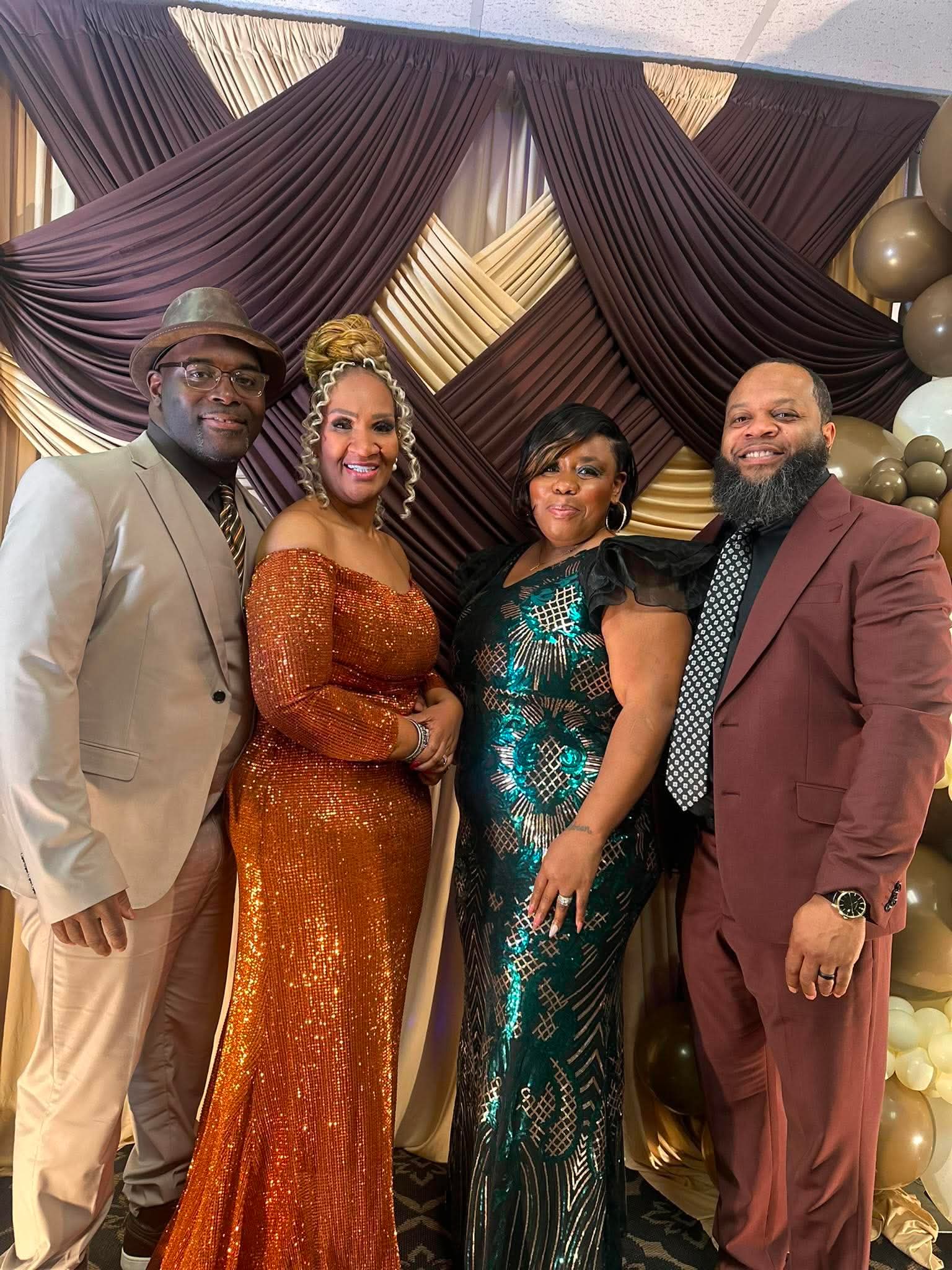 Apostle Theresa and Pastor Tiant Hawkins Sr. with a married couple